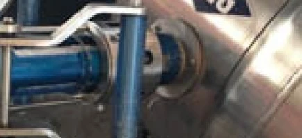 A steel machine with cylinders and pipes made of aluminum and titanium, used for LNG processing.