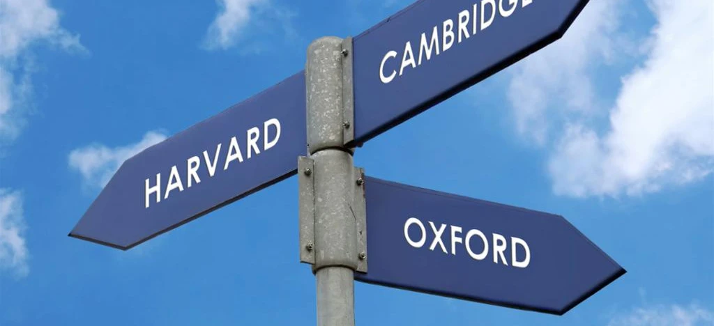 Blue street name sign bearing the words "HARVARD" in Cambridge. Cambridge Audio presents the prestigious universities in a sleek design.
