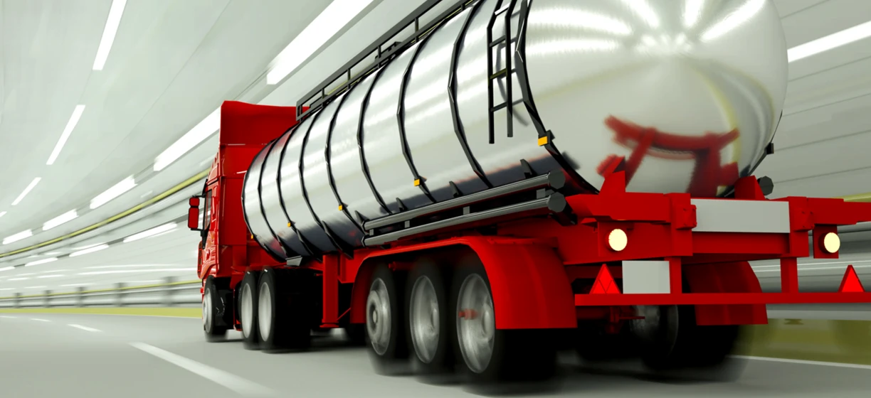 A semi-trailer truck with a storage tank for fuel or water. The commercial vehicle is equipped with an automotive wheel system for freight transport.