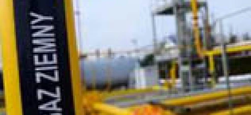 A metal pipe connected to an industrial machine used for transporting natural gas. Iron cylinder in a steel pipeline storage tank for GAZ ZIEMNY.