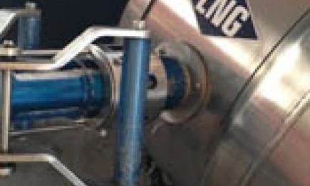 A steel machine with cylinders and pipes made of aluminum and titanium, used for LNG processing.