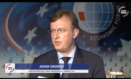 A man in formal wear with glasses and a microphone on his forehead, speaking as a spokesperson at the Economic Forum. Adam Sikorski, Chairman of the Supervisory Board of UNIMOT S.A.