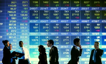 Image of a businessperson giving a presentation through electronic signage at a convention. The audience is engaged with the multimedia display device. Keywords: Technology, Advertising, Businessperson, Multimedia, Audience.