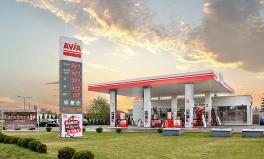 Gasoline and diesel fuel dispensers at Carrefour filling station. Various fuel prices displayed for SUVs and cars. Visit us for a discount on fuel.