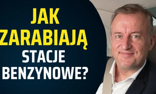 Osoba prowadząca firmę w formalnym ubraniu, nosząca koszulę i marynarkę z widocznym kołnierzykiem. Tekst po polsku pytający "Jak stacje benzynowe zarabiają pieniądze?" #SEO #Biznes #JęzykPolski