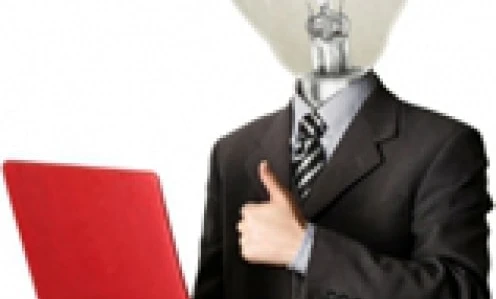 A white-collar worker sitting at a desk with an electronic device and laptop, surrounded by office supplies. Keywords: Job, Technology, Computer hardware.